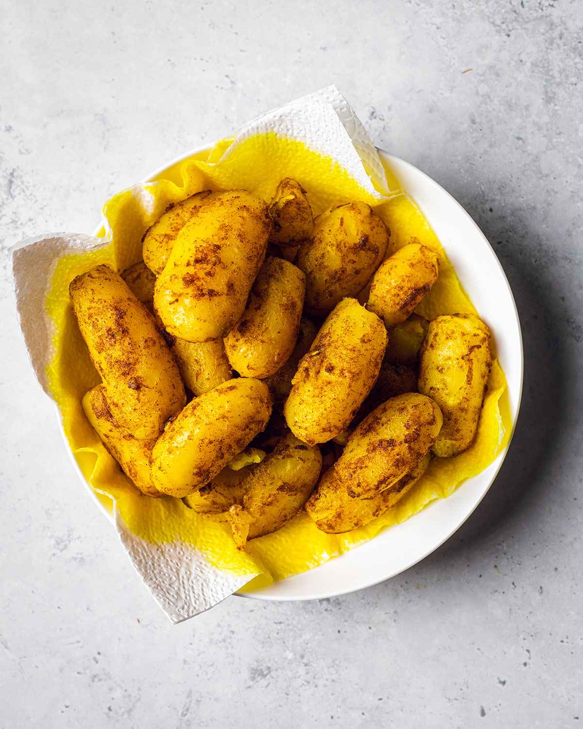fried seasoned potatoes in a bowl