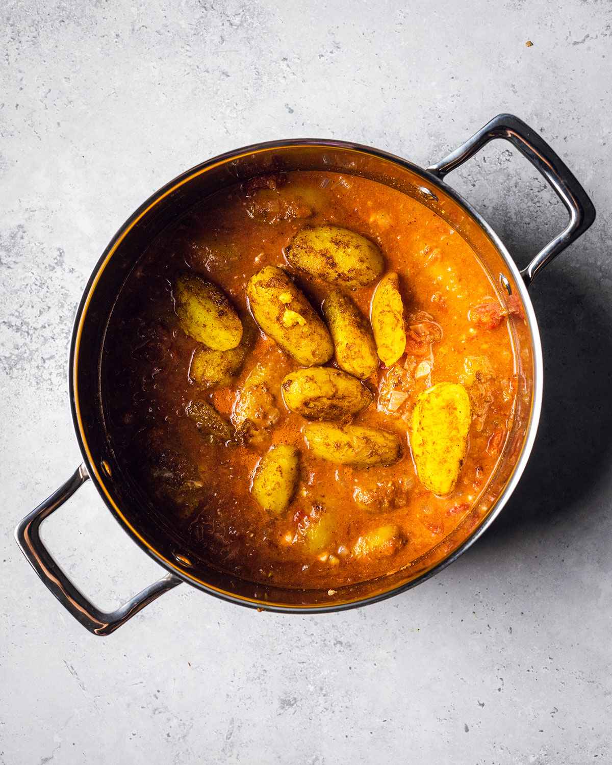 coconut yogurt and fried potatoes added to the Olav saucepan