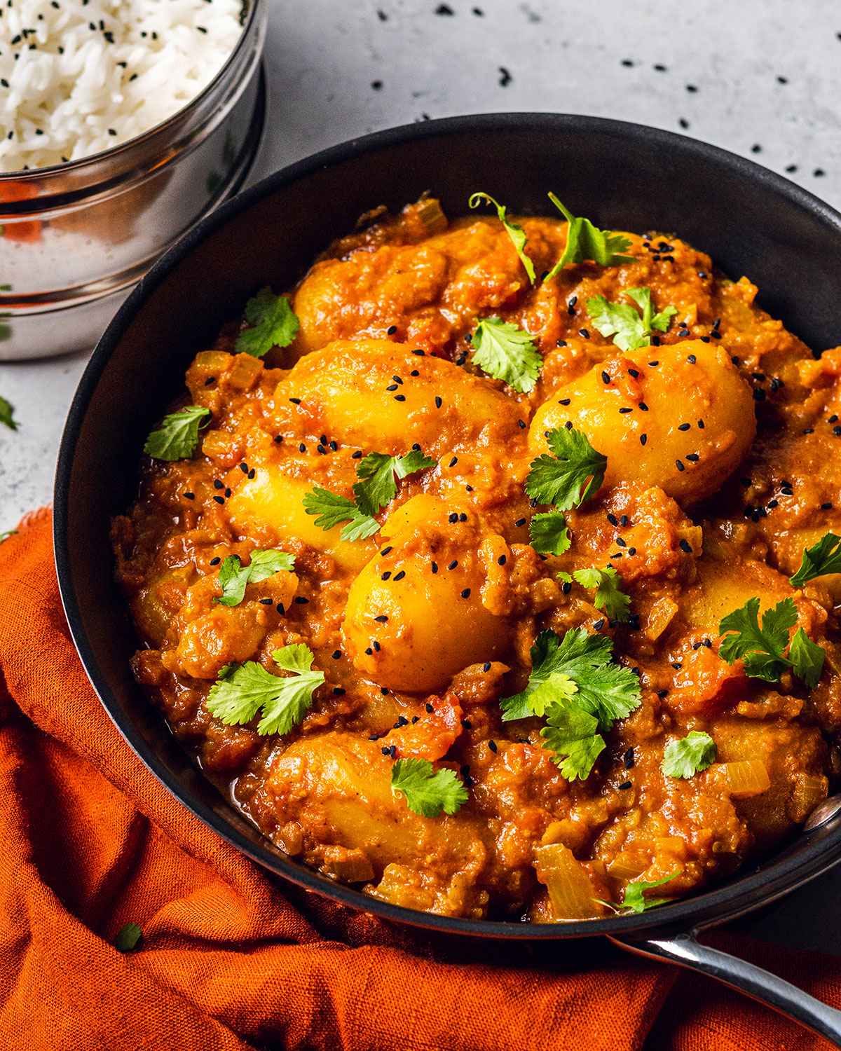 dum aloo recipe for potato curry in a skillet