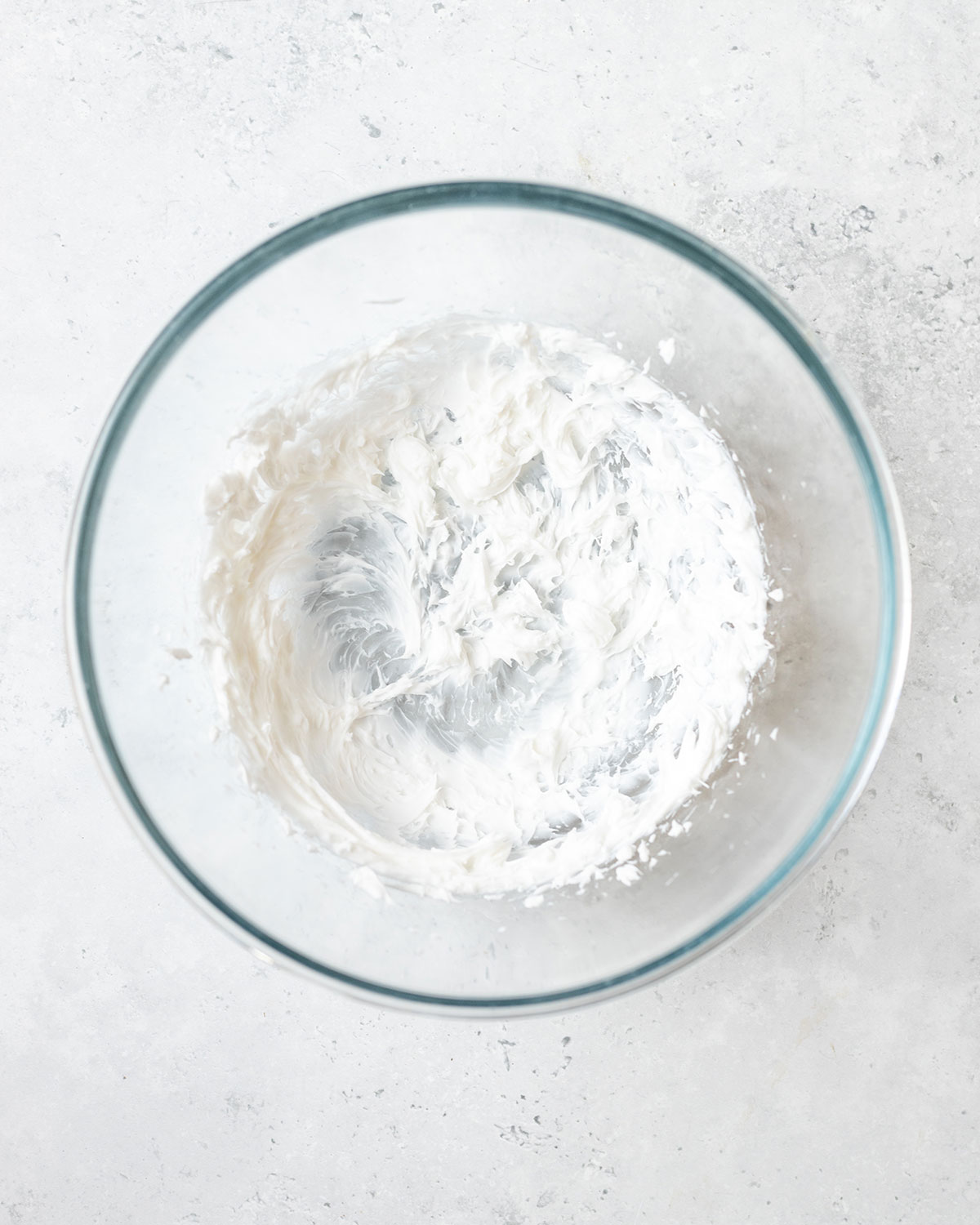 whipped up cream cheese in a glass bowl