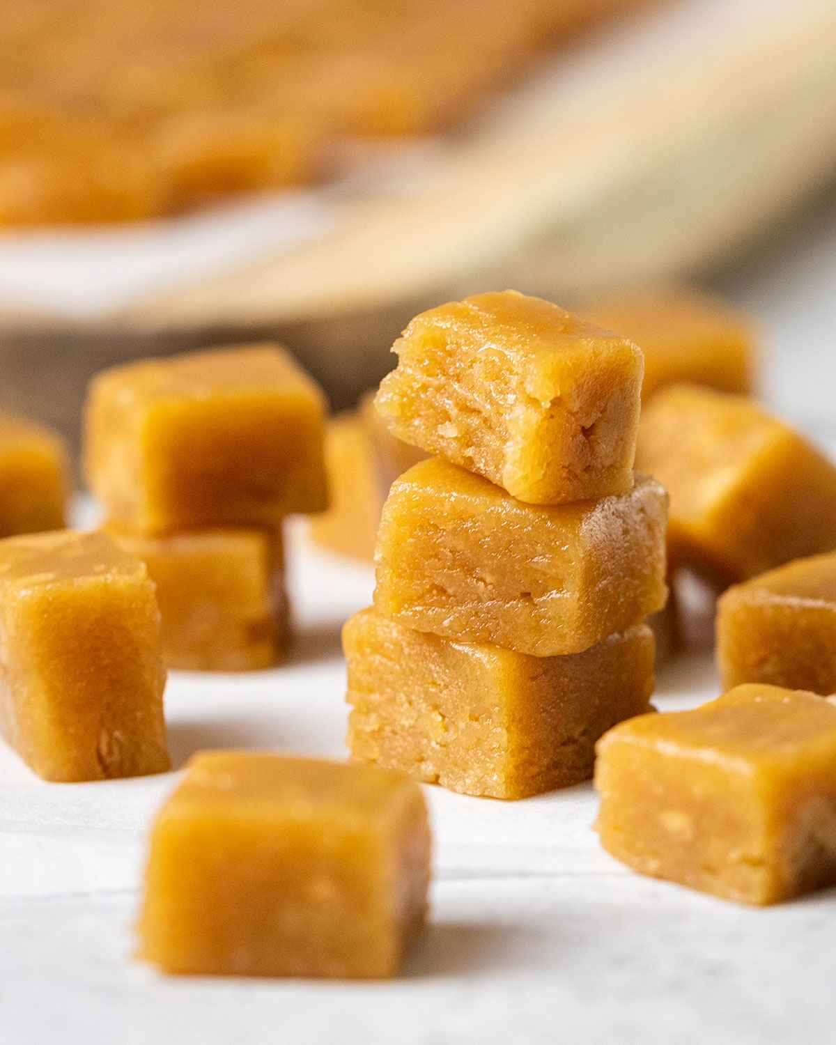 a stack of fudge with a bite taken out of the top one