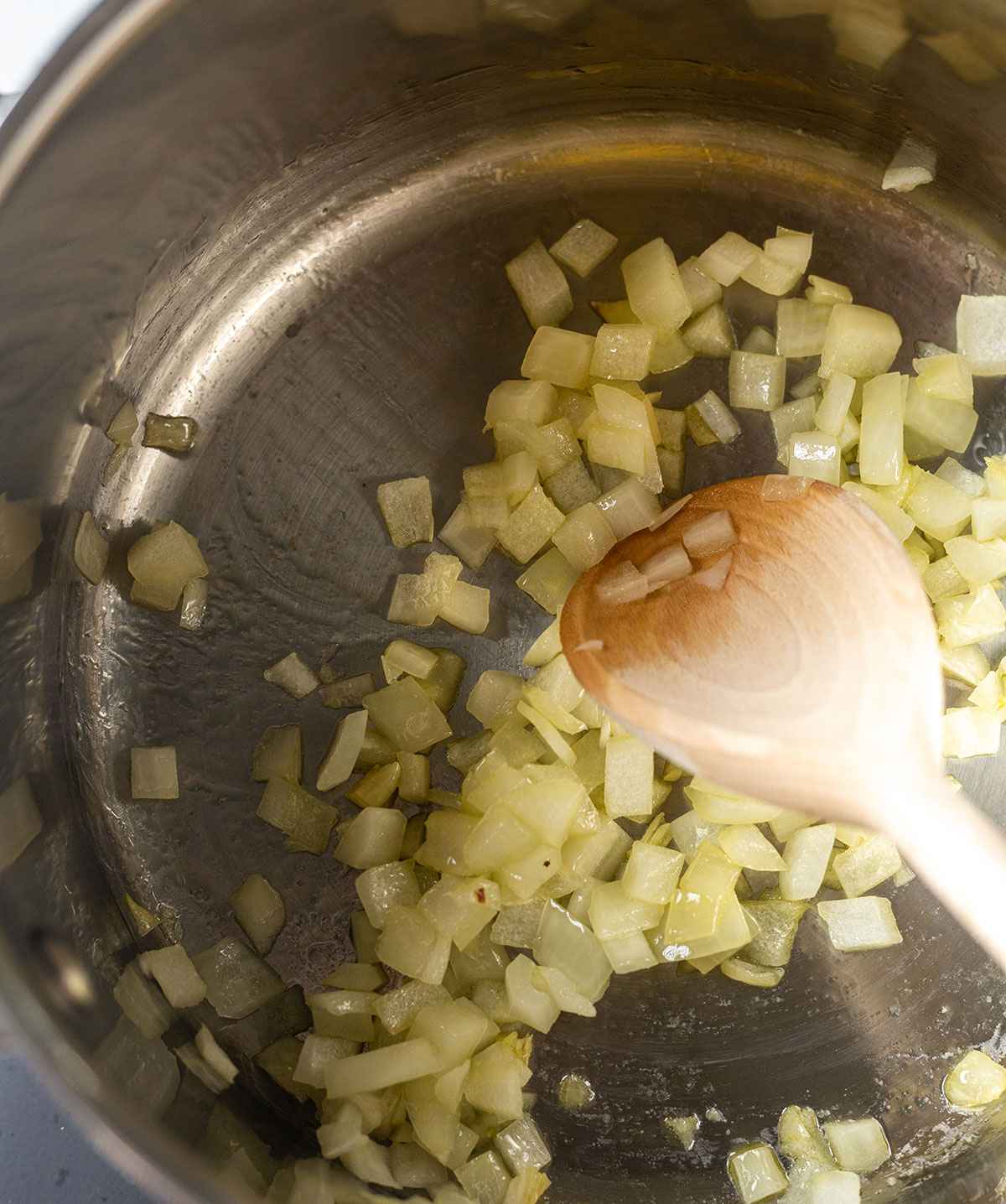 onions sautéing in a saucepan