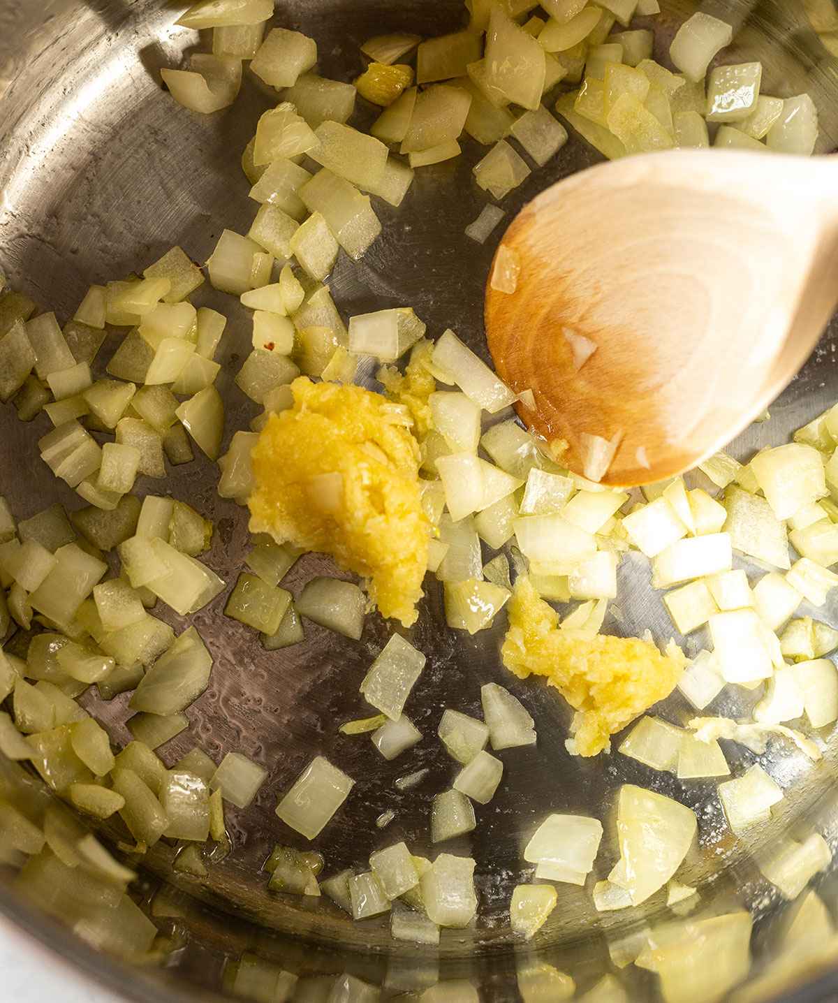 grated garlic added to the saucepan