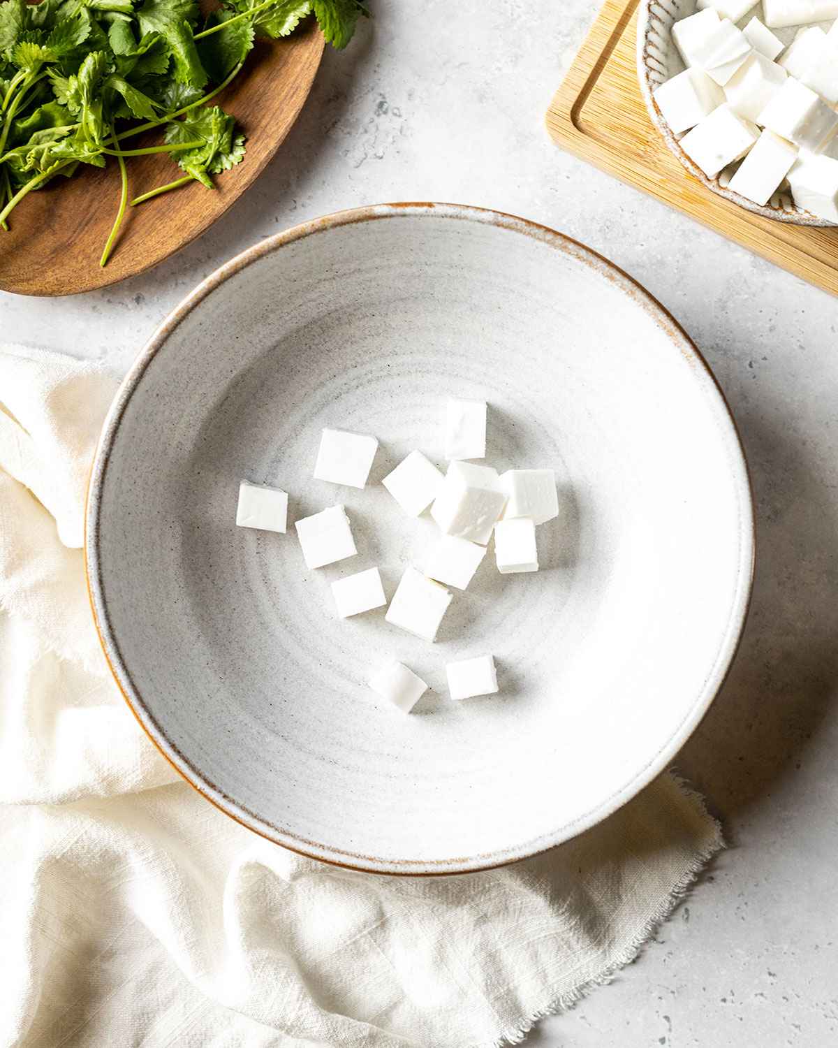 cheese cubes in a bowl on the dinner table