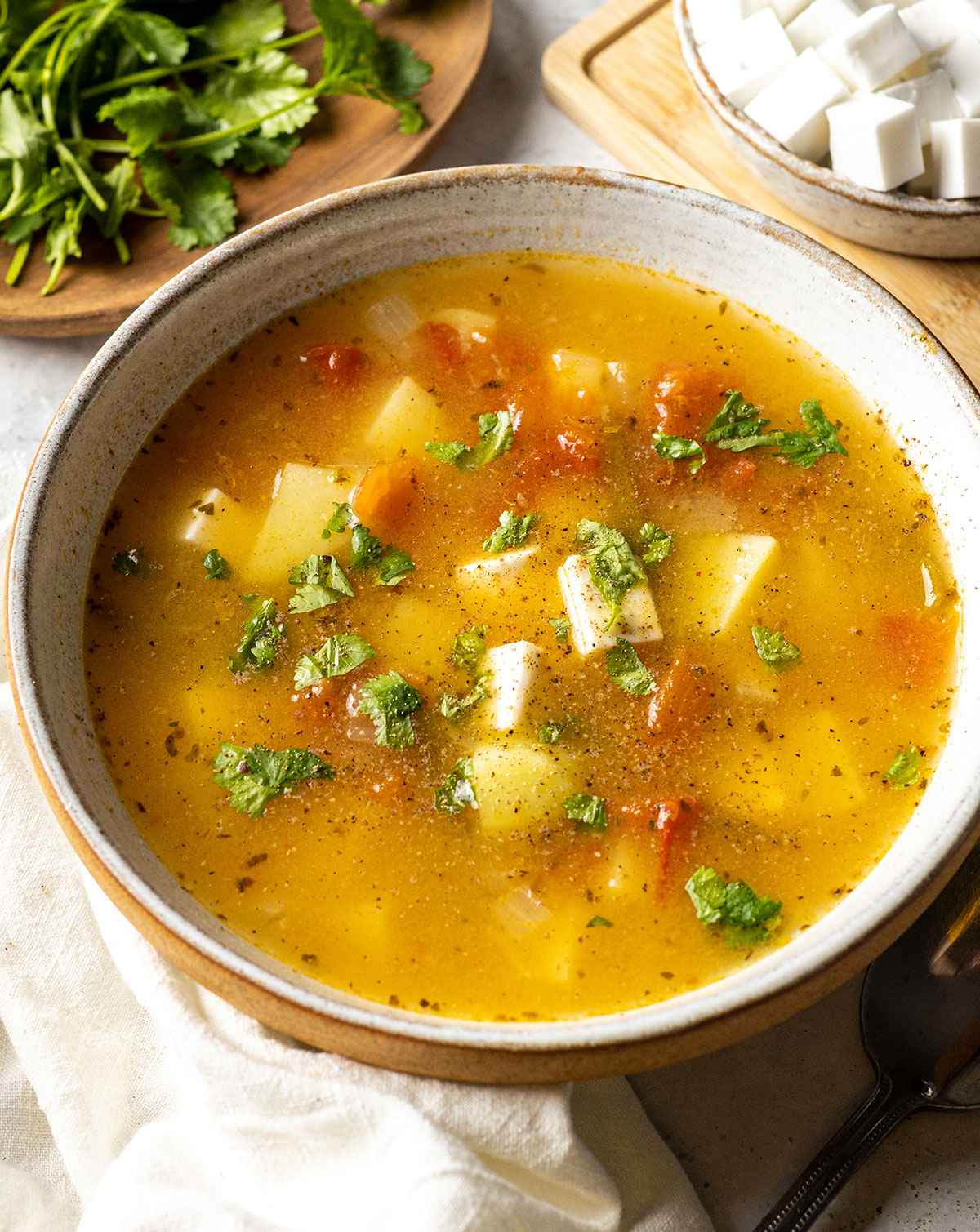 a bowl filled with mexican caldo de queso (mexican cheese soup)