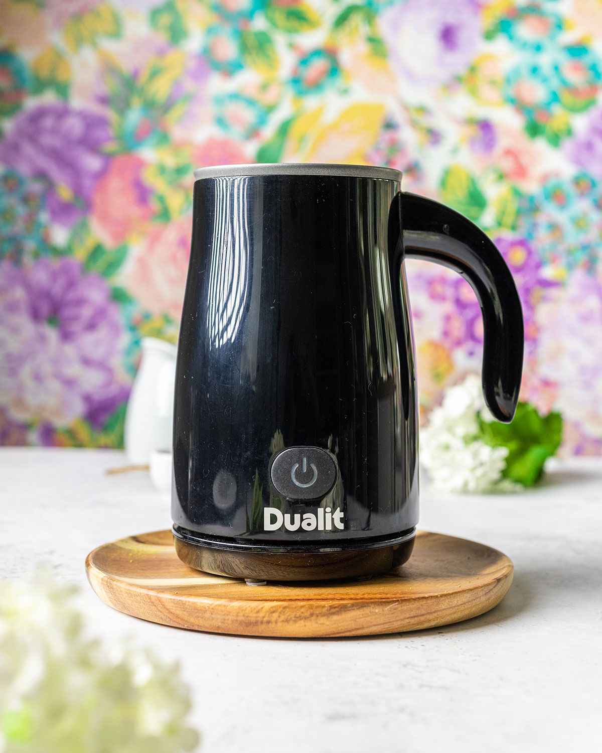 dualit black milk frother on a white table