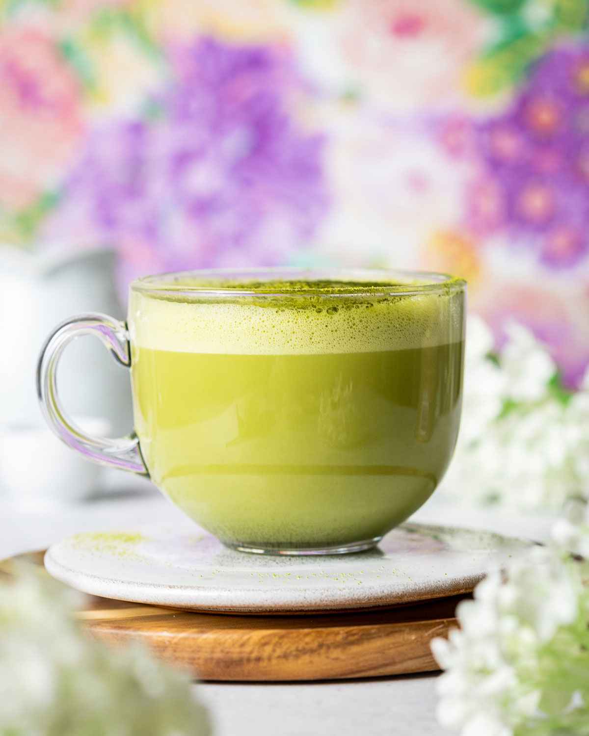 a glass mug filled with matcha latte made in the style of the known Starbucks recipe