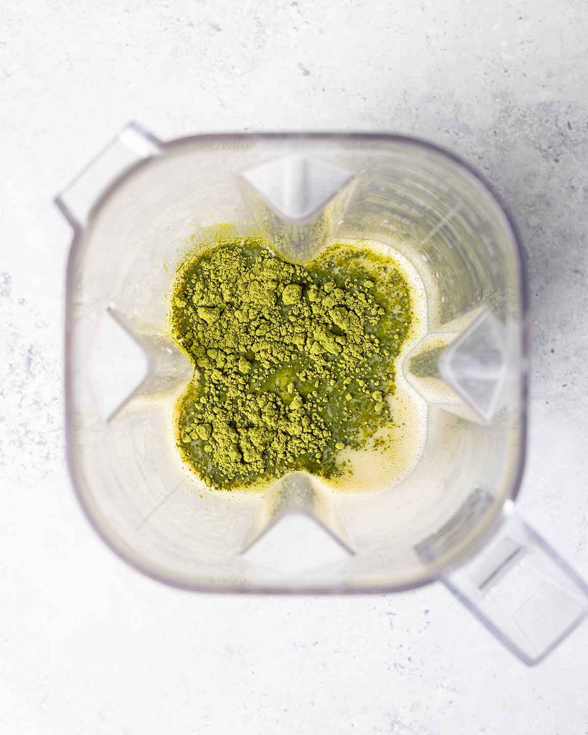 ingredients for matcha latte in a blender as see from