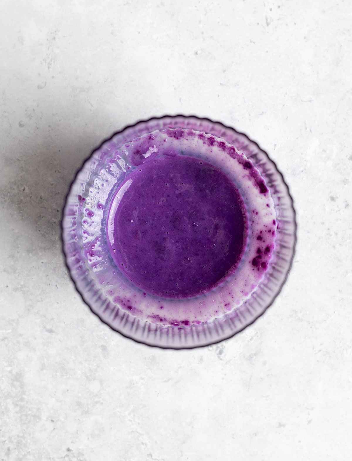 dissolved purple yam powder in water in a glass