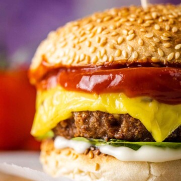 close up of a vegan burger with beyond meat patty, lettuce, mayo and ketchup