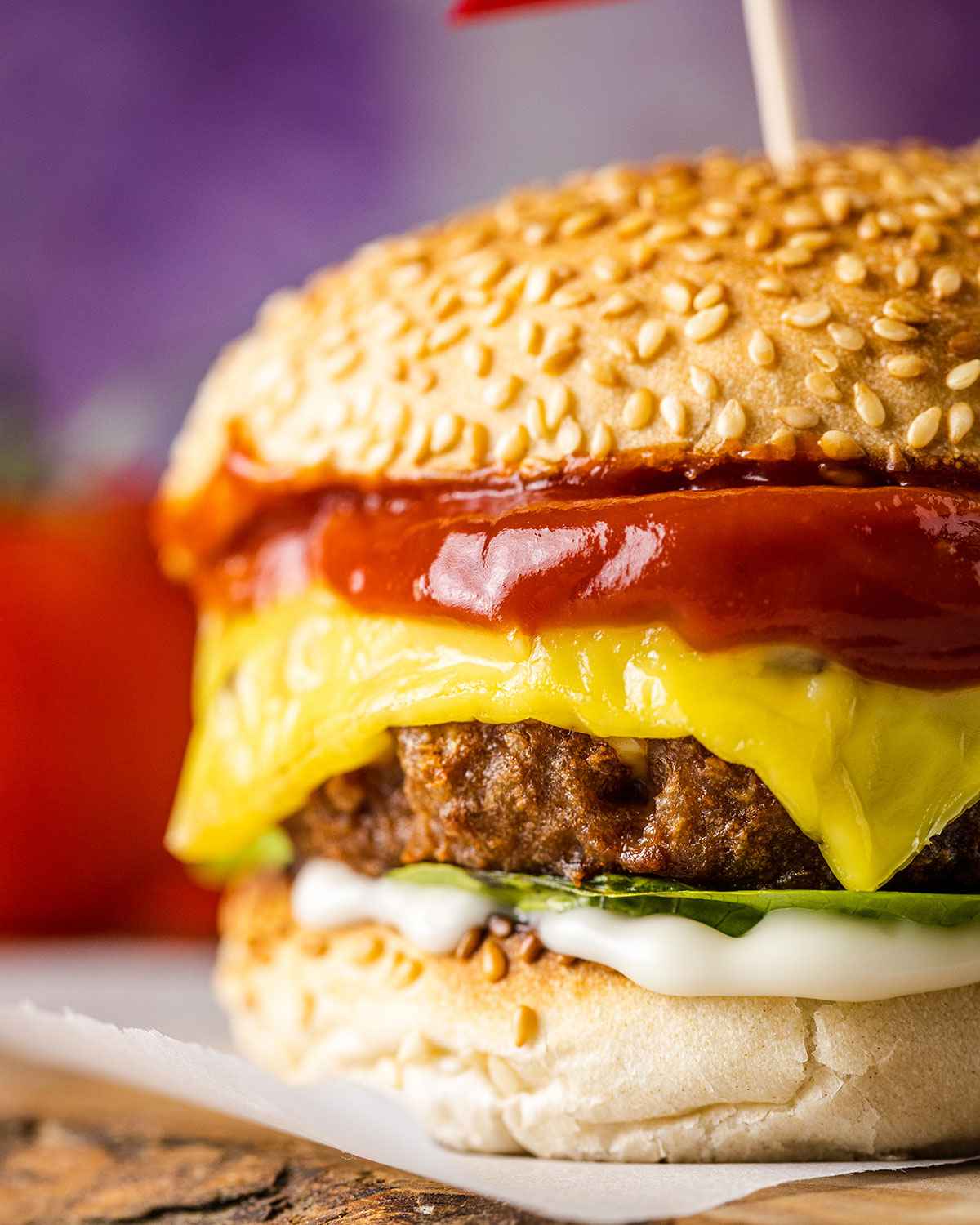 close up of a vegan burger with beyond meat patty, lettuce, mayo and ketchup