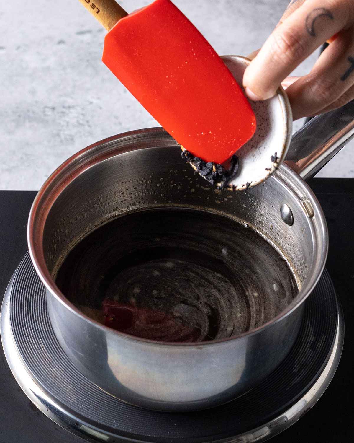 adding vanilla seeds to the saucepan