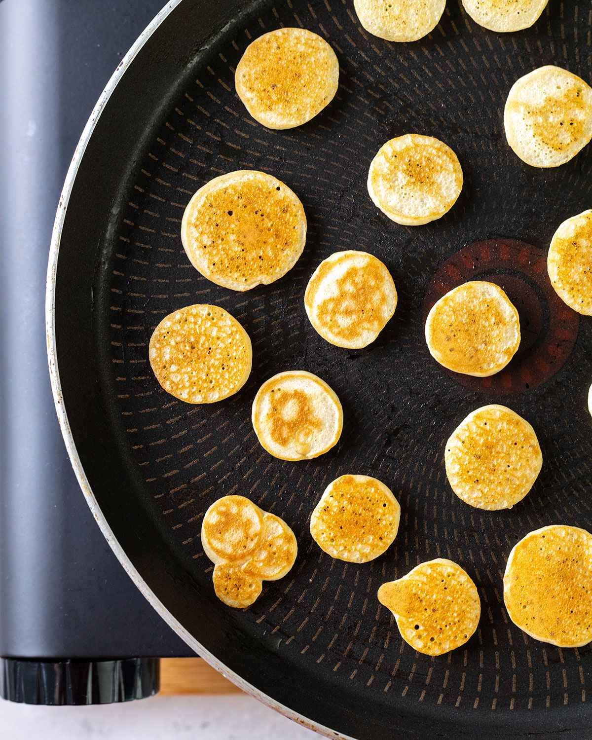 mini pancakes in a skillet