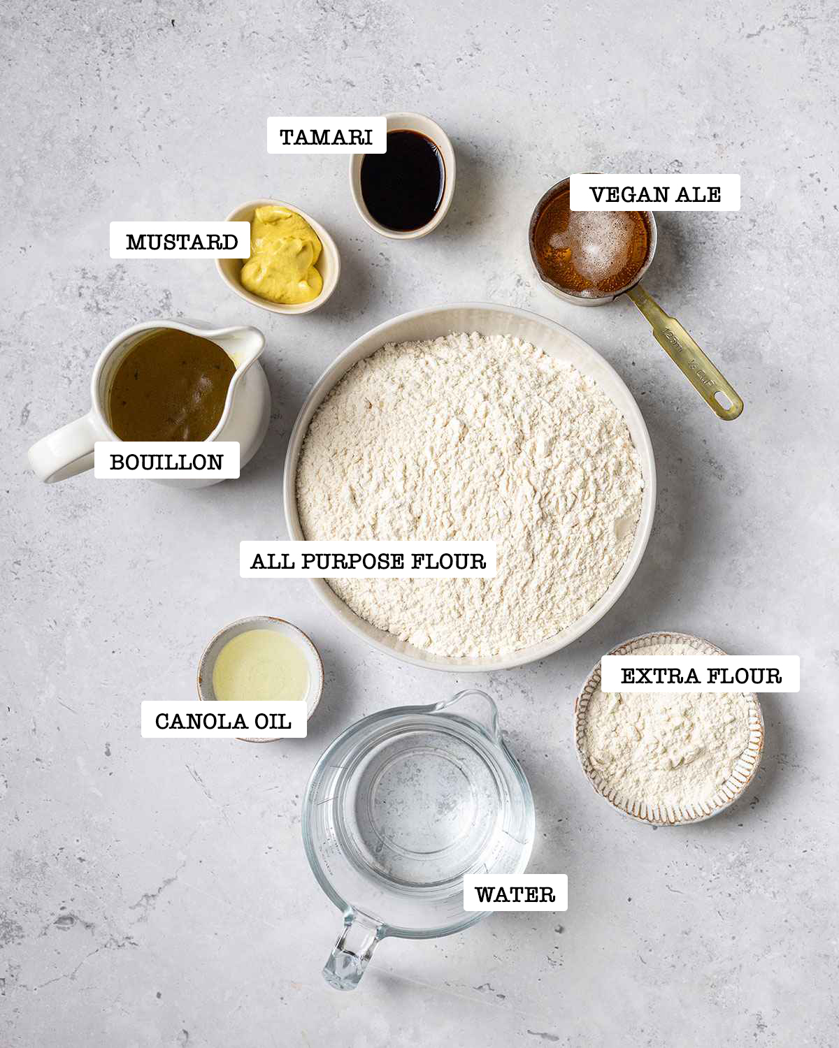 ingredients for flour washed seitan on a white marble background