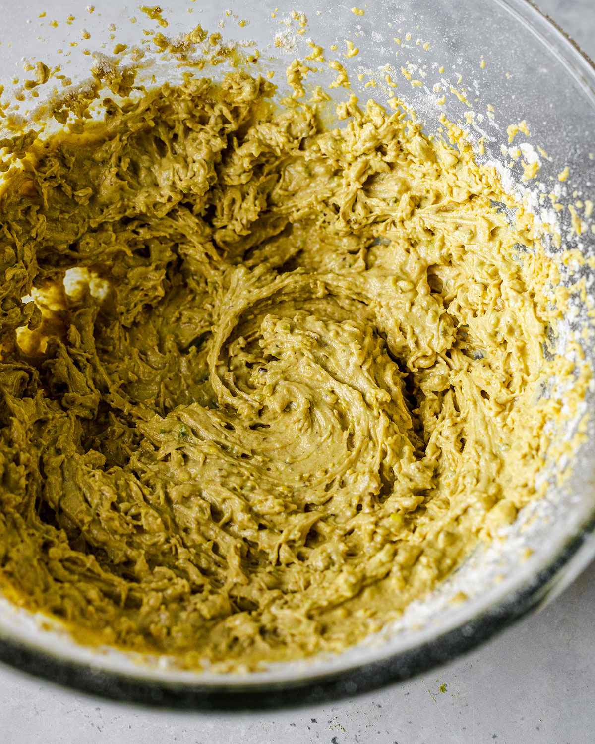 Cookie dough for pistachio cookies in a mixing bowl.