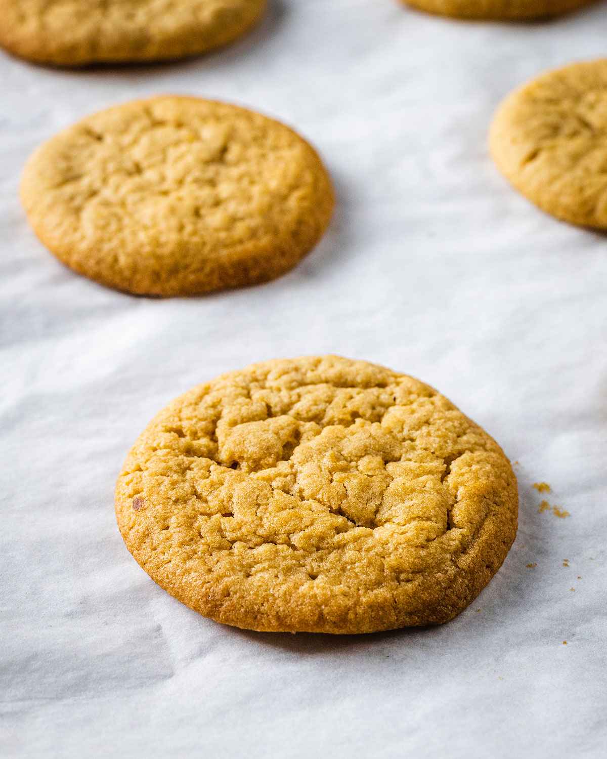 freshly baked cookies on a white baking parchment