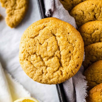 close up of a vegan cookie on the edge of a cookie jar