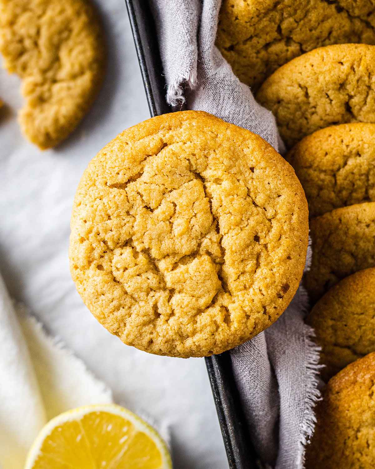 close up of a vegan cookie on the edge of a cookie jar