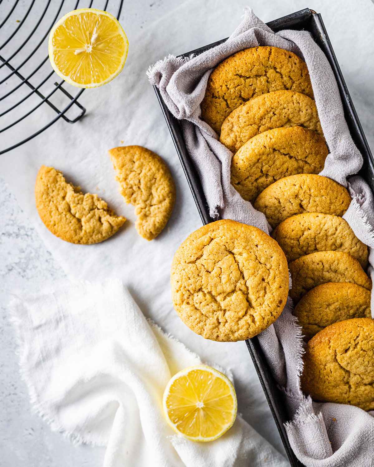 Lemon cookies on a marble background with fresh lemons