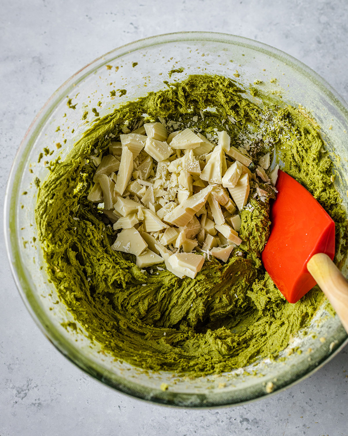 White chocolate chips add it into the green Matcha cookie dough with a spatula on the side