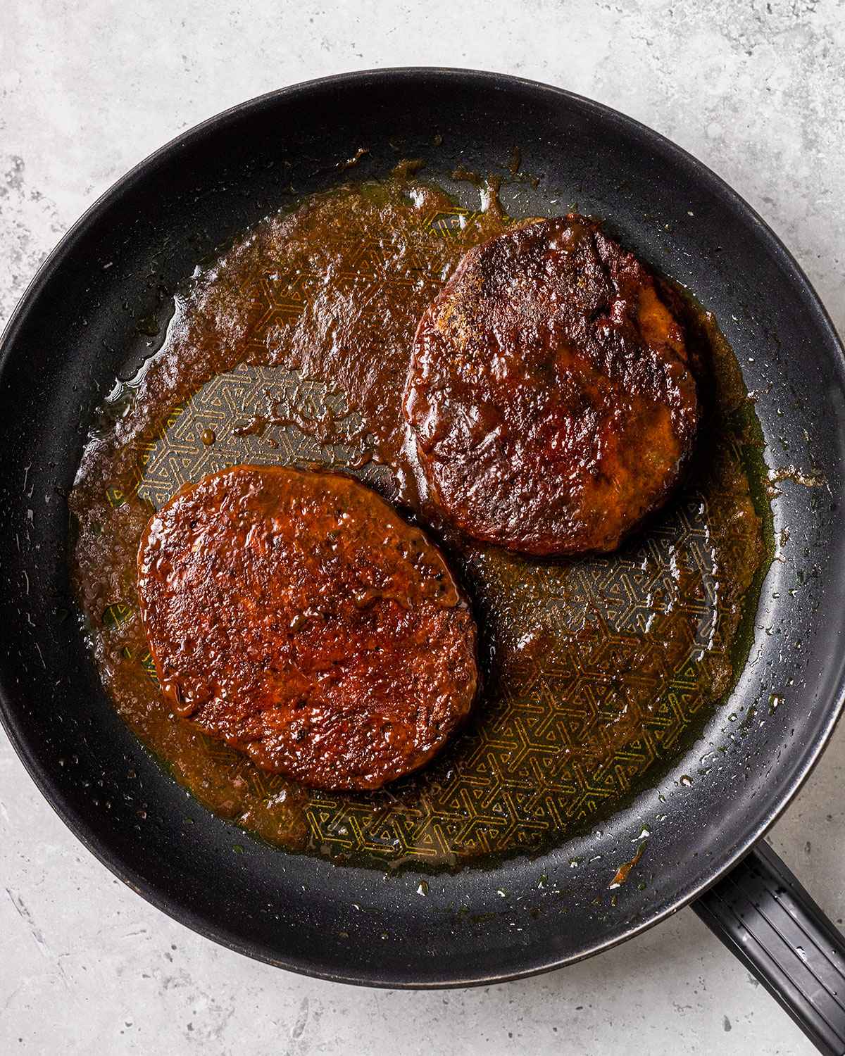 two seitan steaks in a skillet