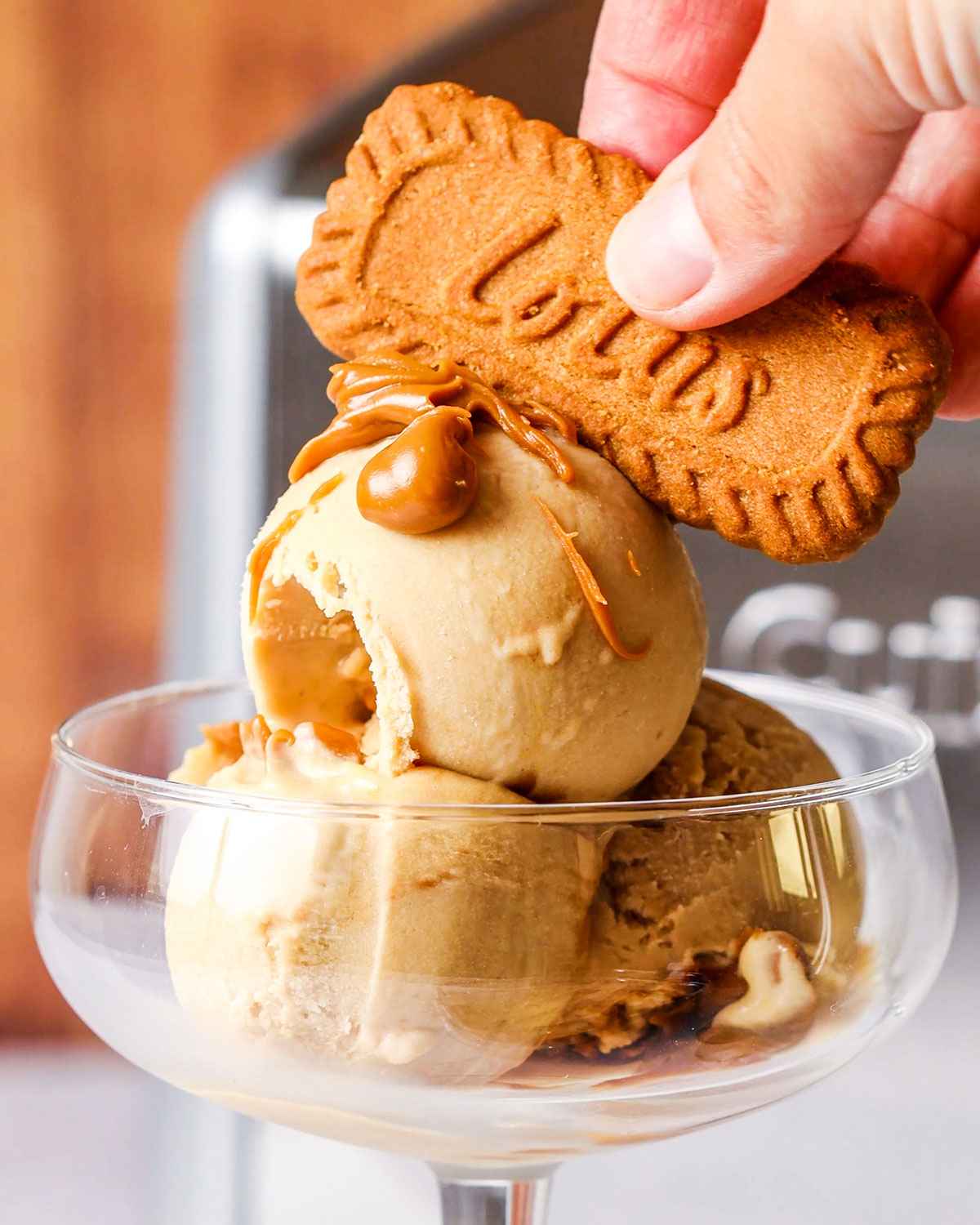 Biscoff Ice cream in a glass with a biscoff biscuit on top