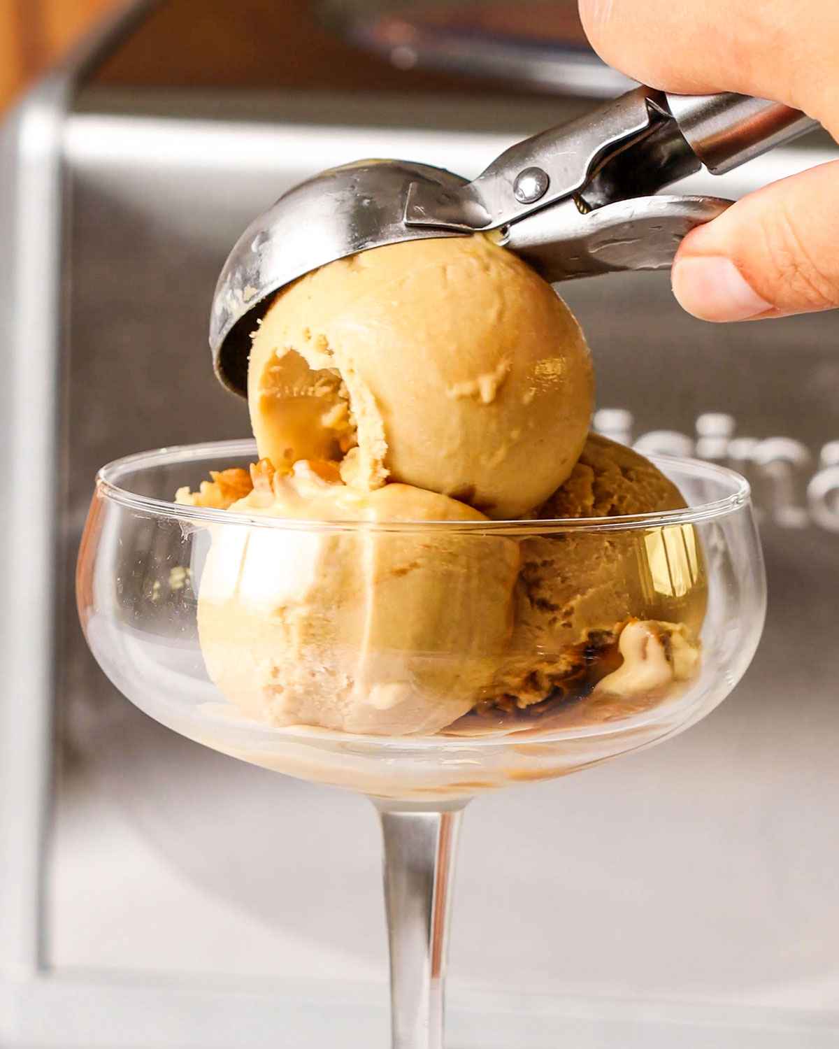 serving homemade ice cream in a beautiful glass