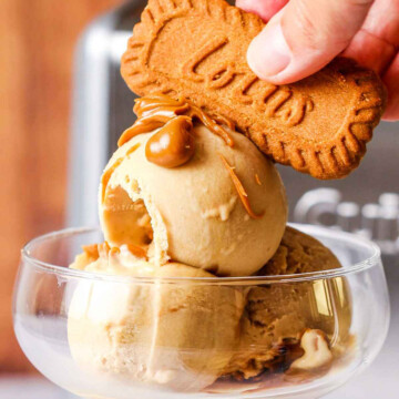 Homemade Biscoff Ice Cream in a serving glass with a biscuit on top
