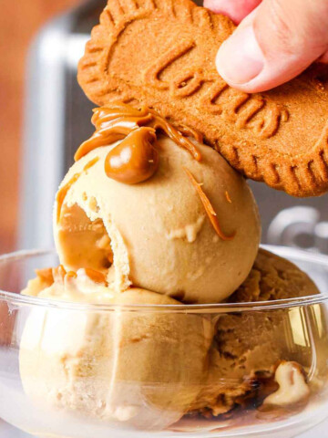 Homemade Biscoff Ice Cream in a serving glass with a biscuit on top