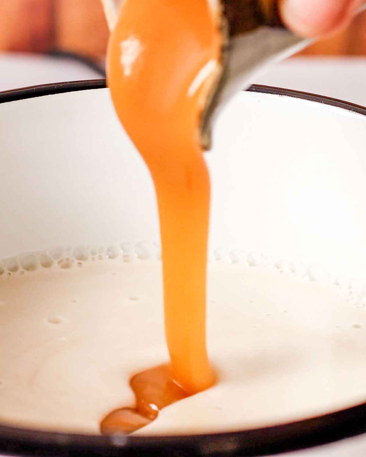 drizzling condensed milk into the mix