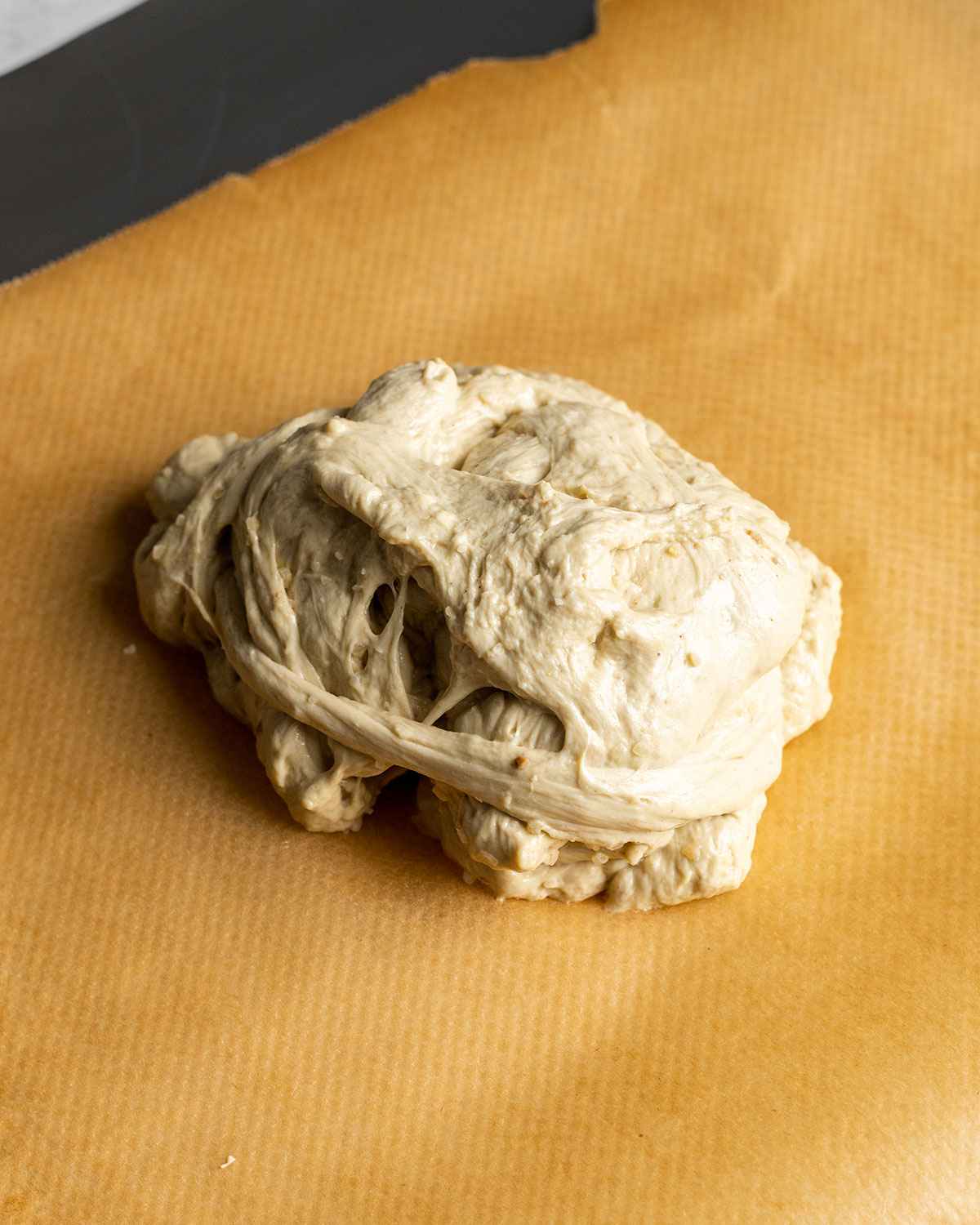 chicken seitan dough about to be wrapped in parchment paper and foil