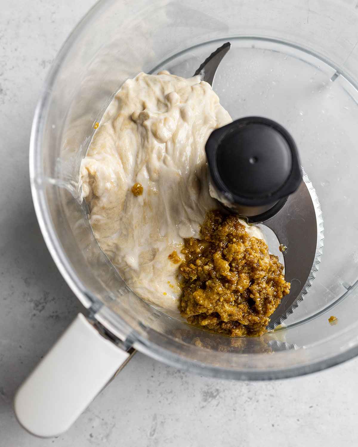 flour washed seitan and chicken seasoning paste in a food processor