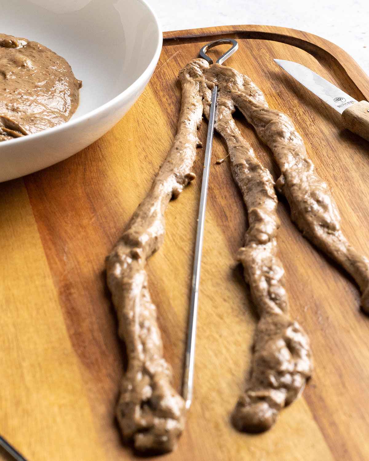 metal skewer pierced through seitan kabob strands