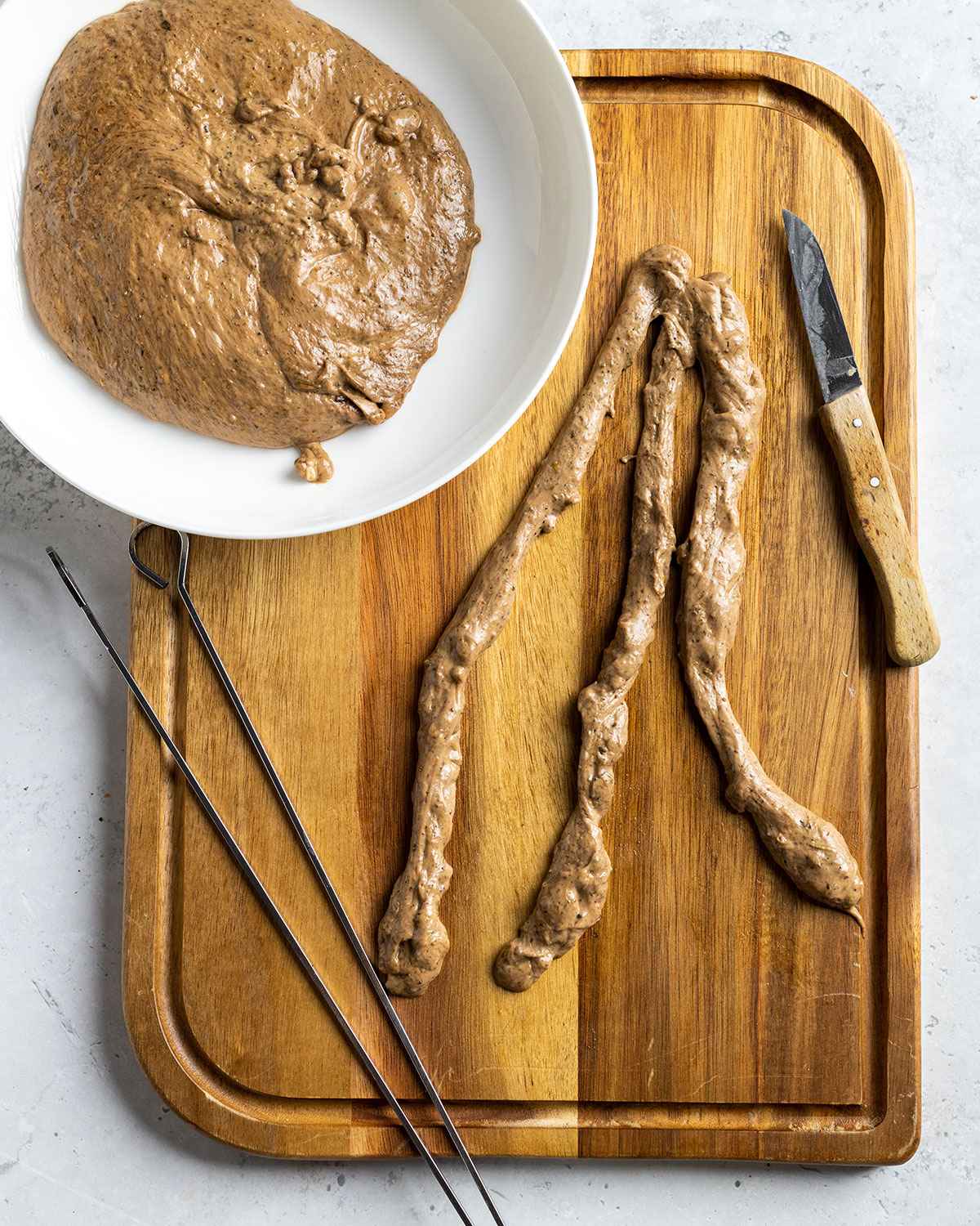 seitan kabob sliced and about to be twirled onto skewers