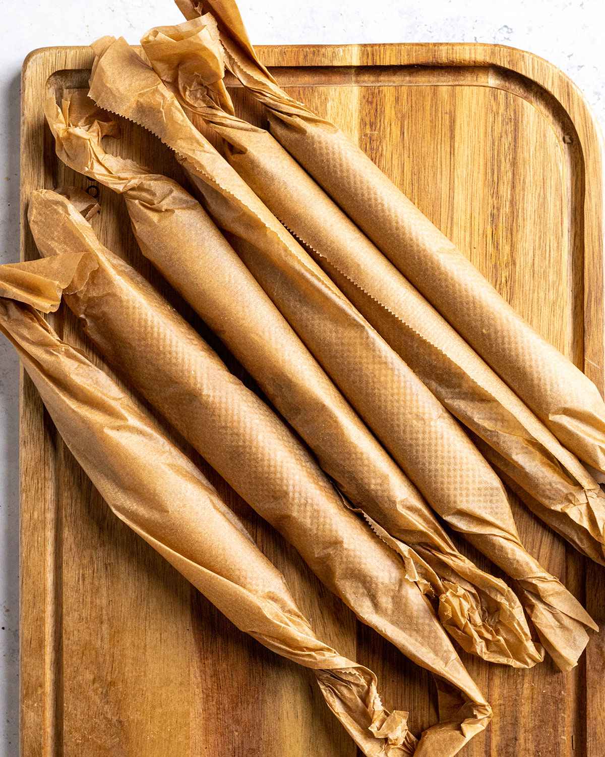 seitan skewers wrapped in baking parchment