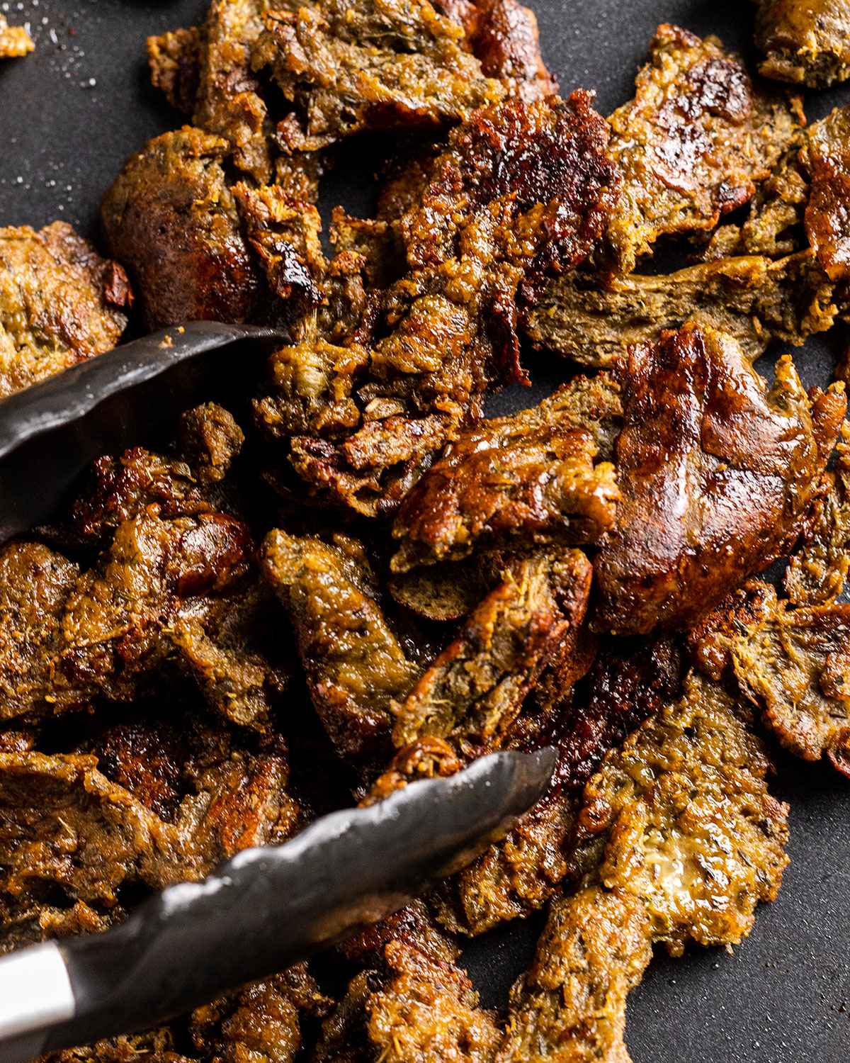 vegan gyros meat shreds made from seitan on the grill