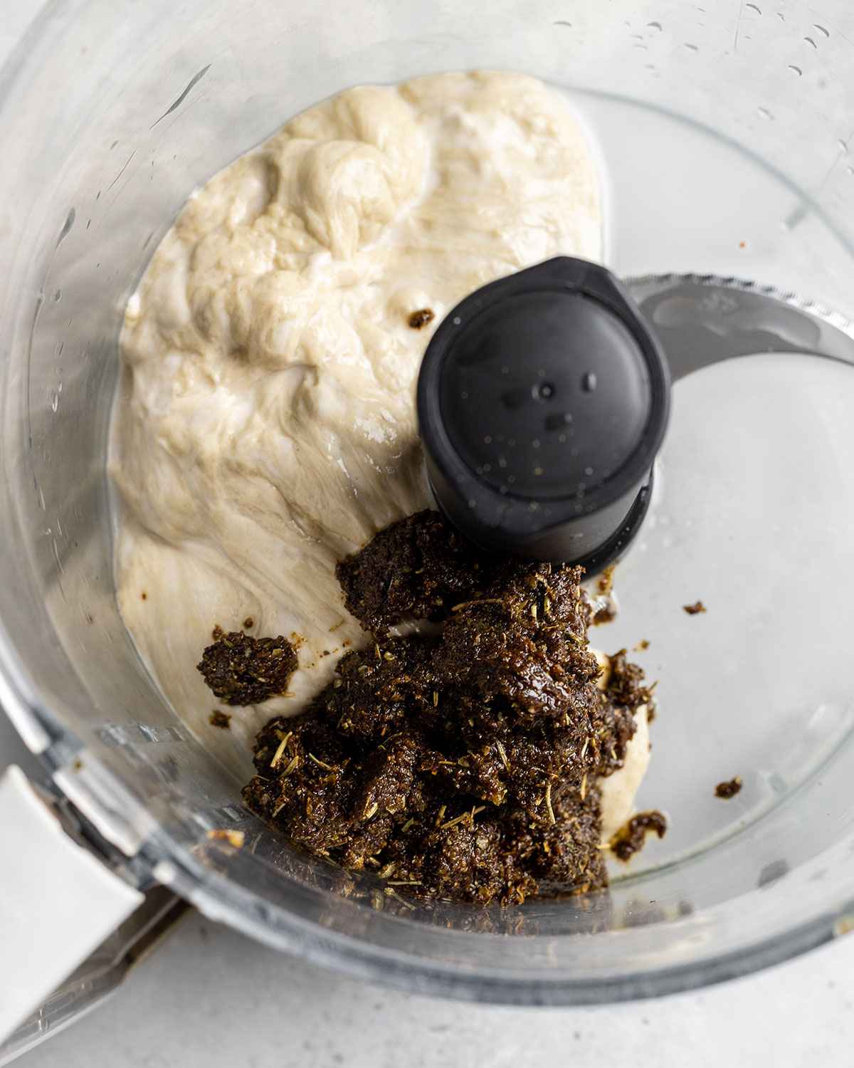 washed flour and gyros flavor paste in a food processor