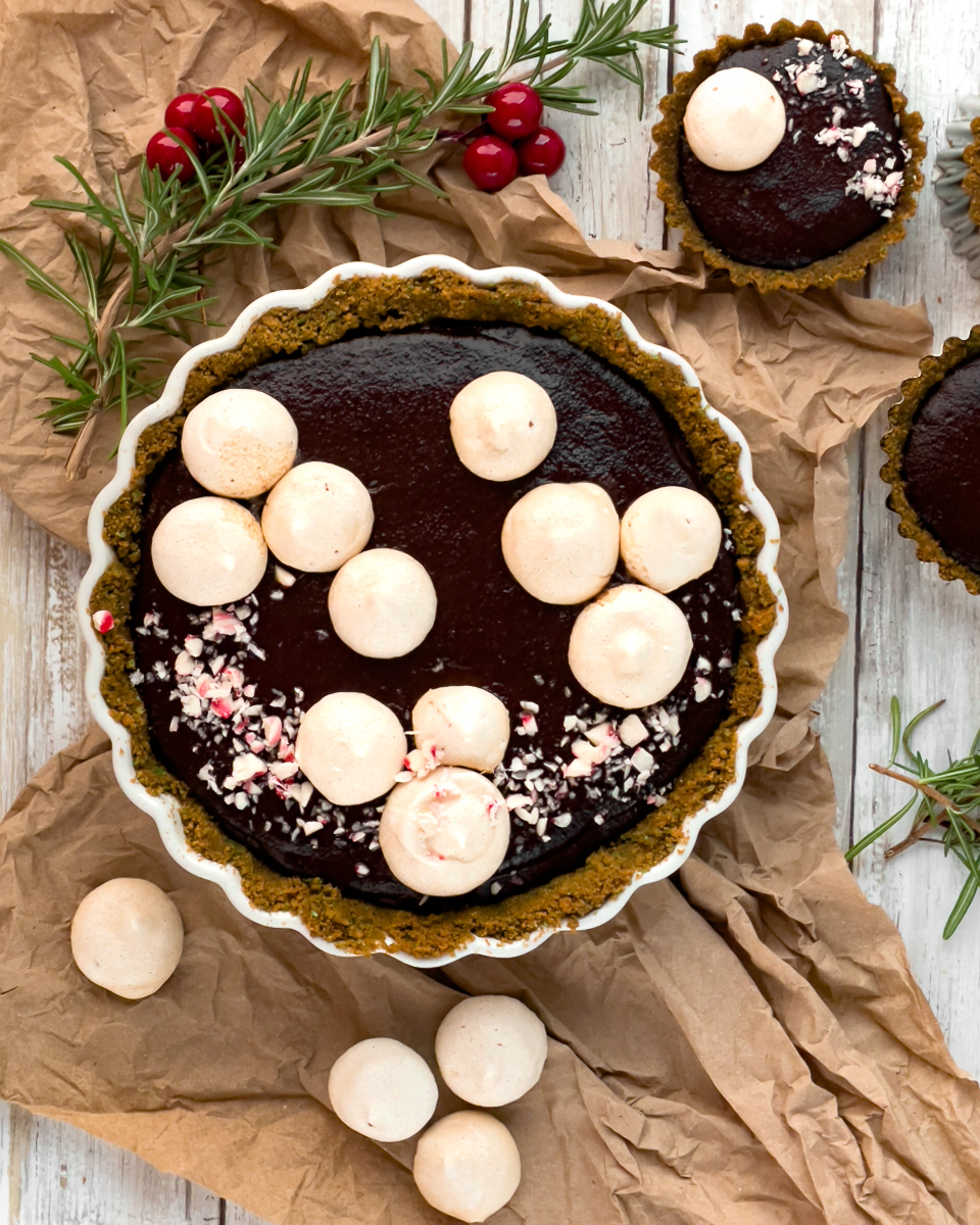 vegan chocolate mint pie seem from above in a pie dish with burlap underneath and festive decorations around