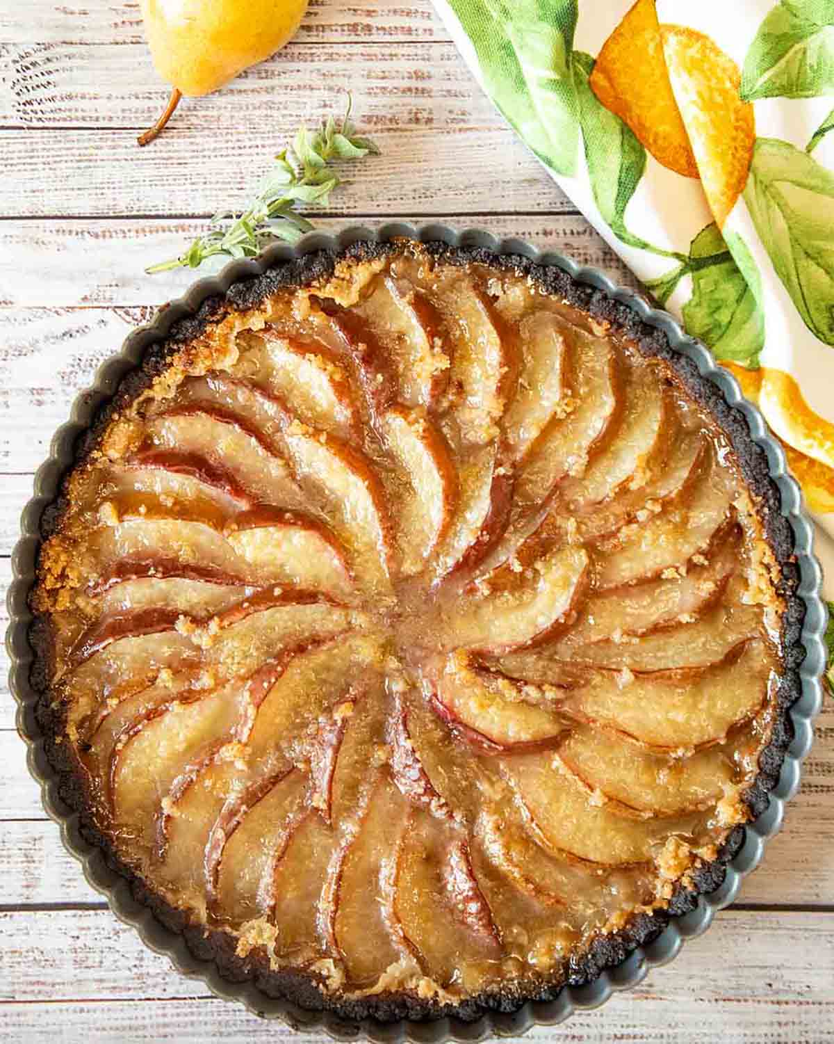 vegan pear tart from above with the pear slices neatly arranged