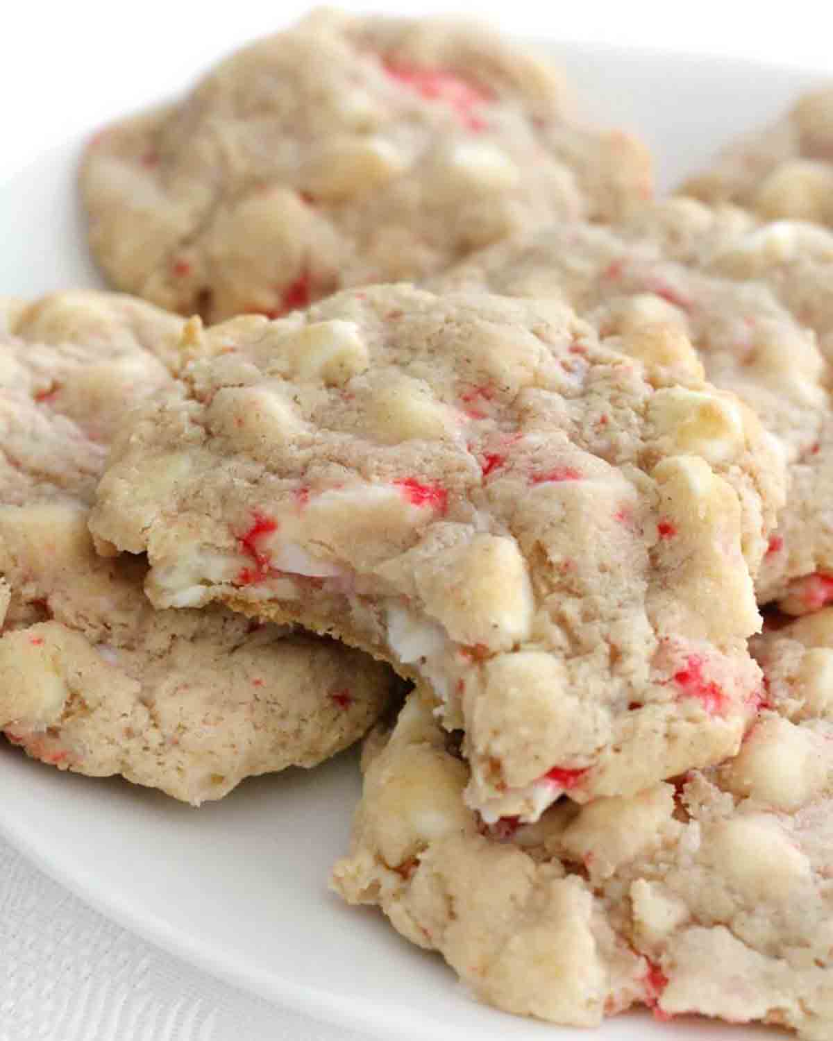 chunky vegan peppermint cookies with white chocolate on a white plate