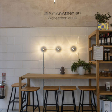 bench with seats inside of The Athenian restaurant in West London