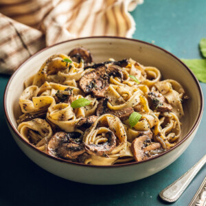 a bowl filled with vegan mushroom pasta