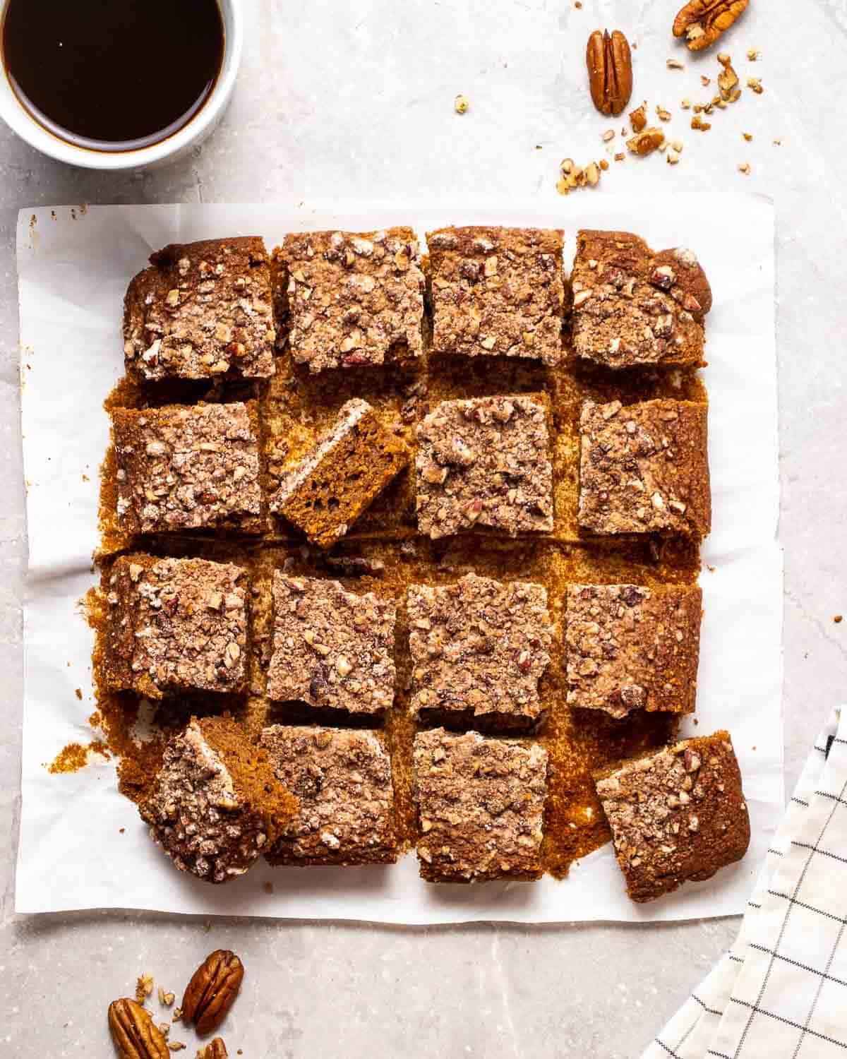 a rectangular vegan coffee cake sliced into square pieces as seen from above