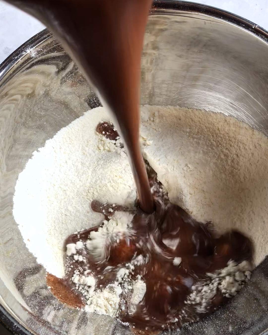 combining wet and dry ingredients in a bowl