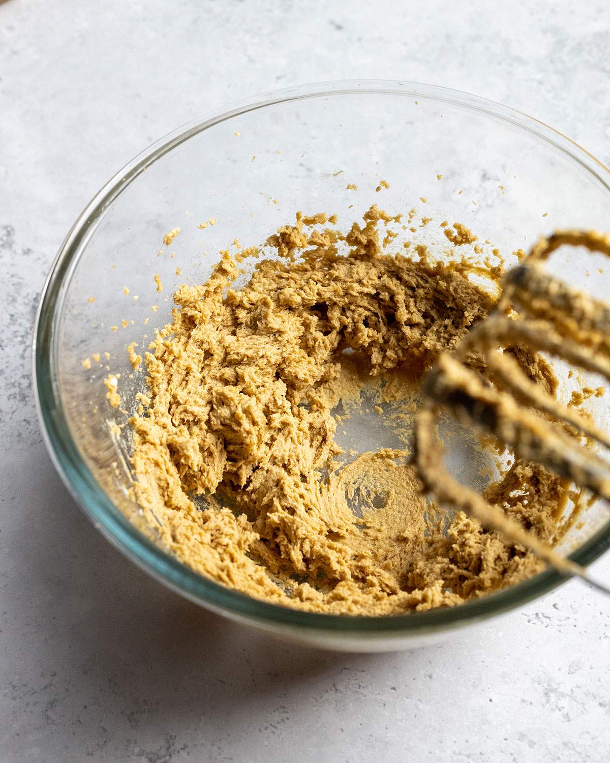 creamed vegan butter and sugar in a glass bowl