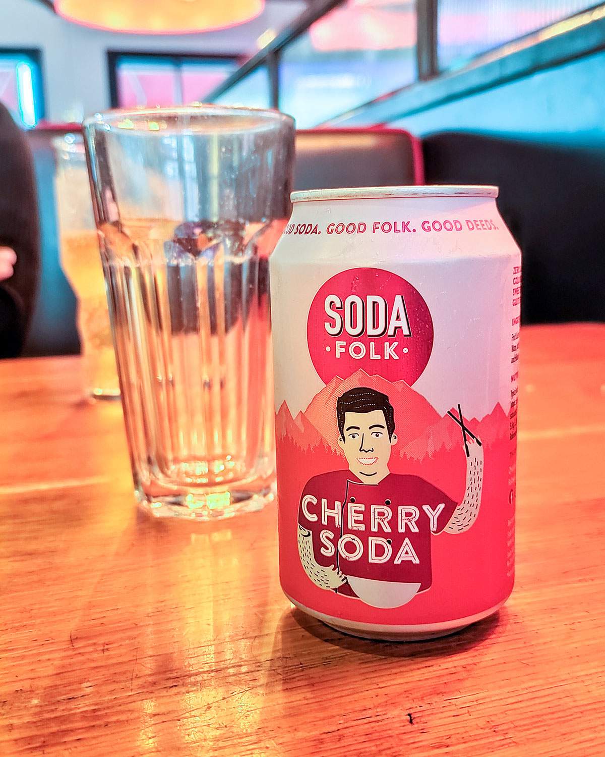 can of soda folk cherry soda on the table at pizza hut