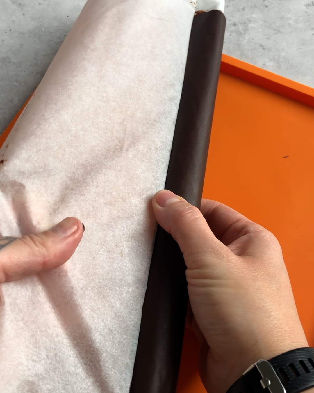 unrolling hardened chocolate from parchment paper