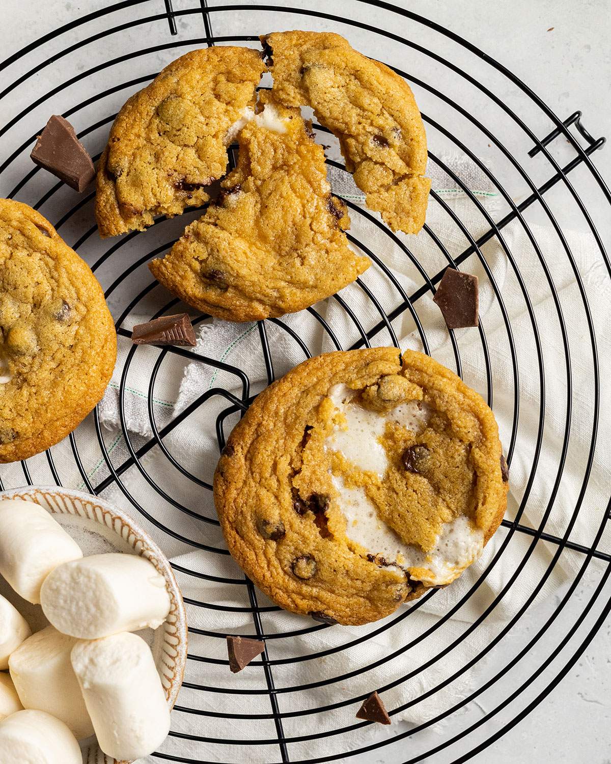 three vegan smores cookies on a cooling rack