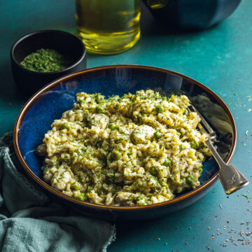 a bowl filled with vegan broad bean spring risotto