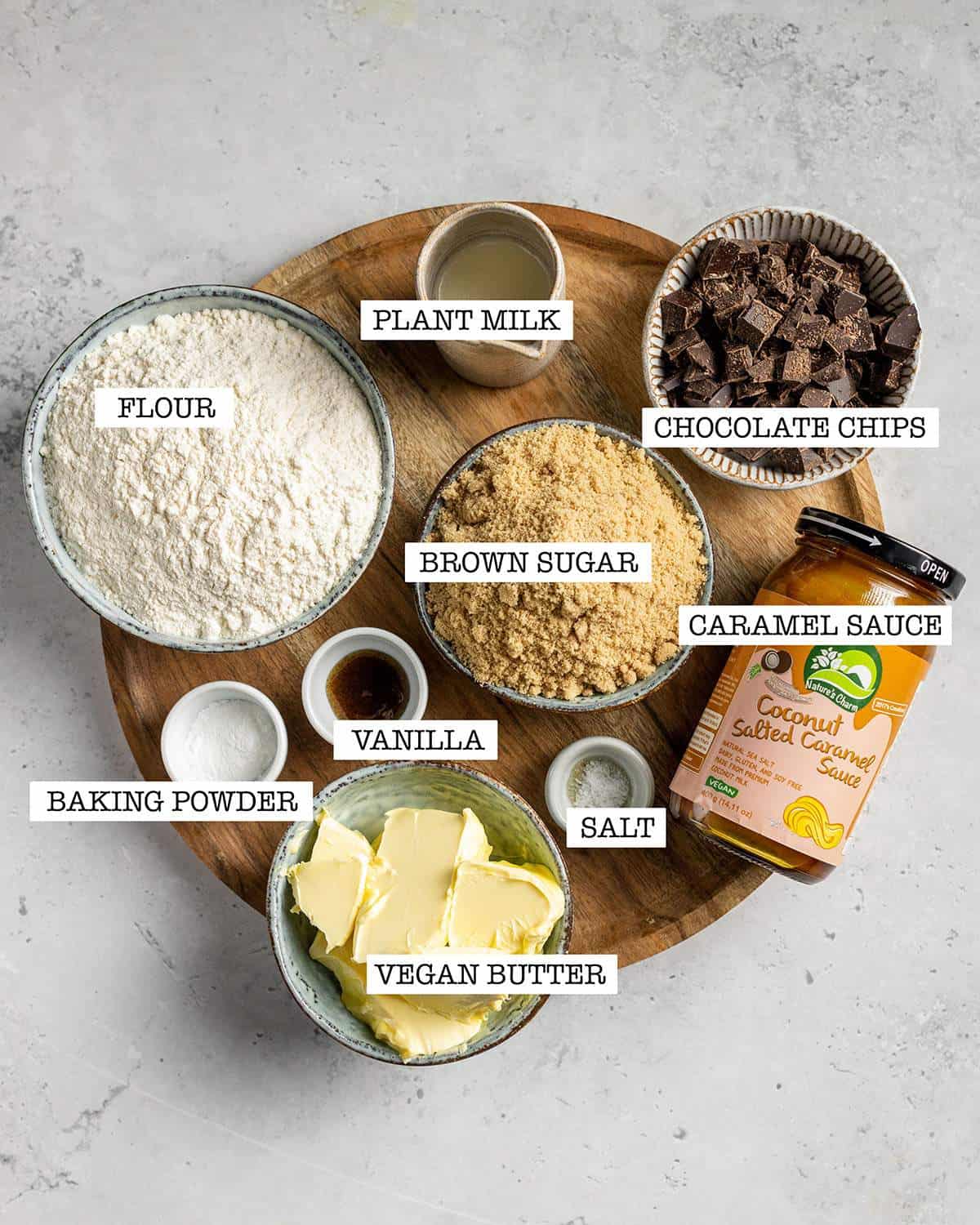 ingredients for vegan cookie cake on a wooden tray